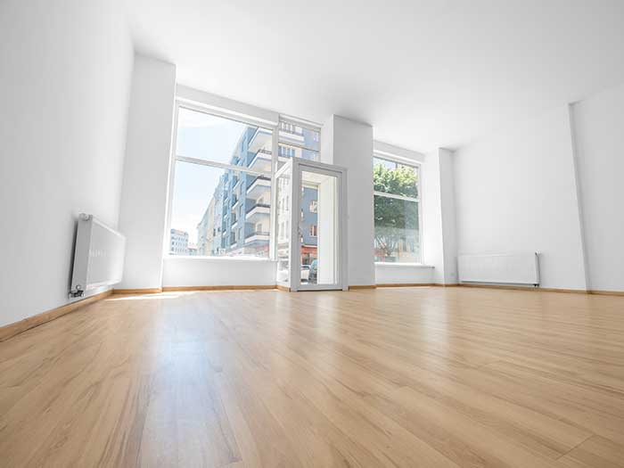 wooden floor with white walls