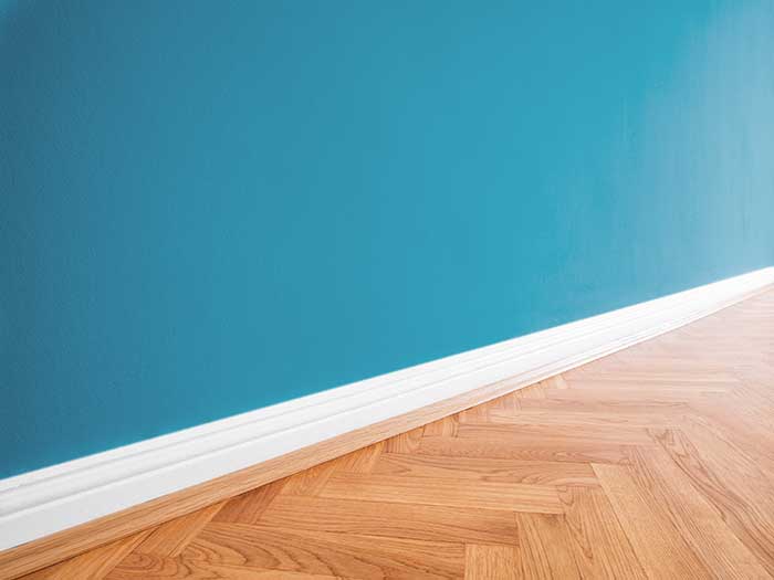 wooden floor with blue wall